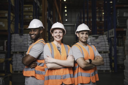 Employees working together in warehouse